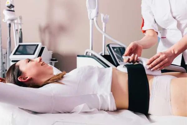woman having body sculpting to help improve her body image and her mental health South Kensington